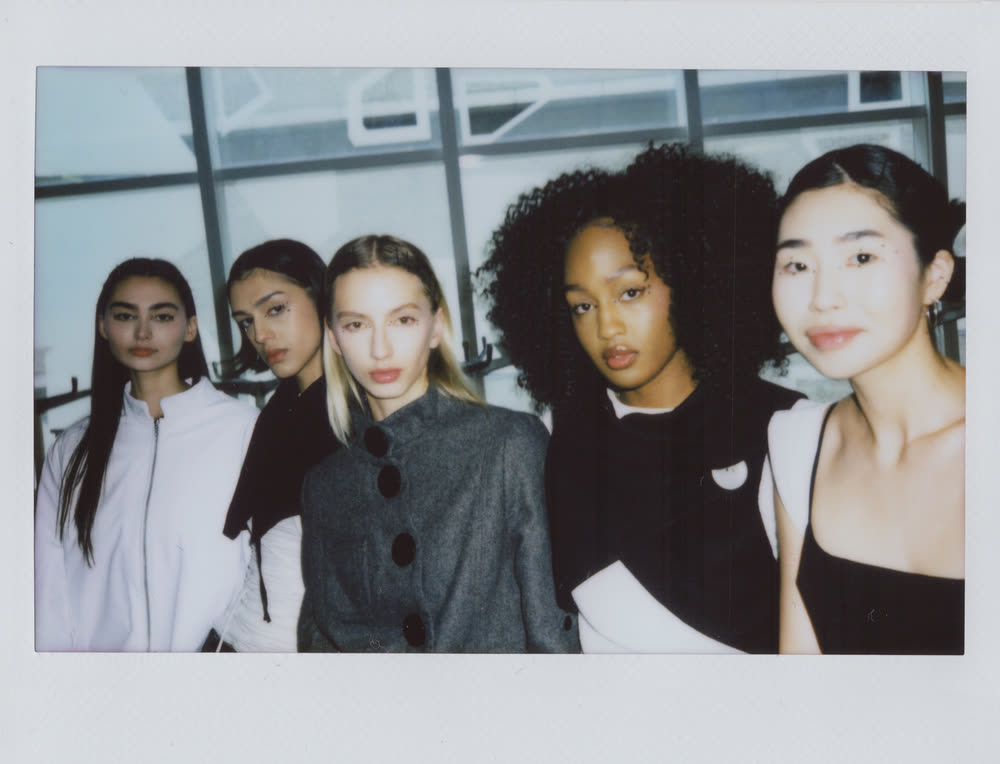 Five models backstage wearing looks from How Sweet It Was.